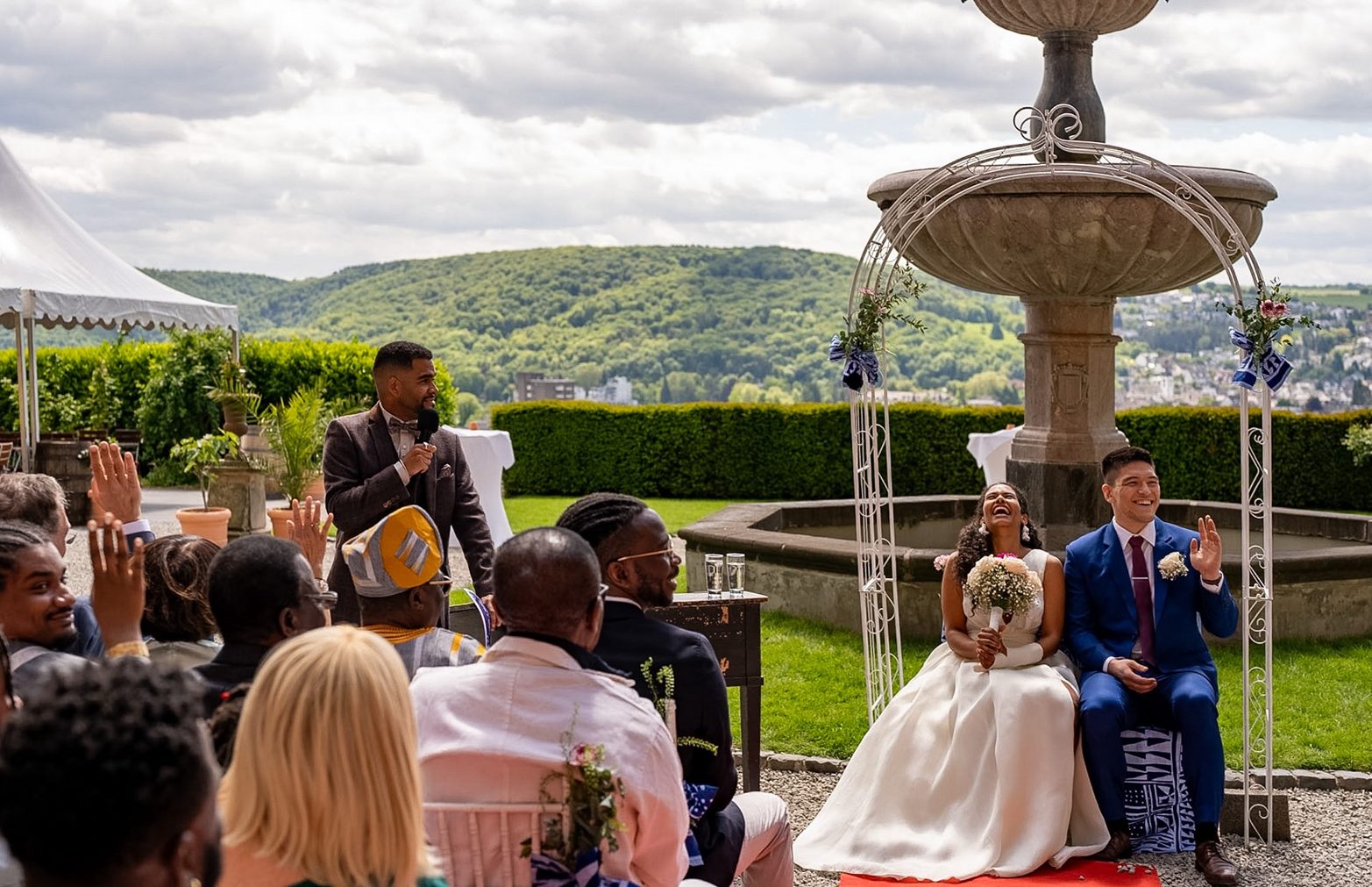 Ludwig Amuam hosting an outdoor wedding ceremony as ceremony master